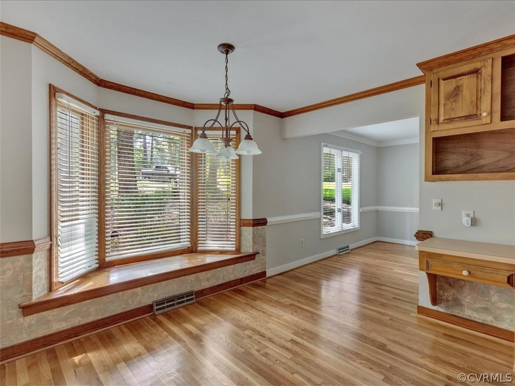 13800 Sterlings Bridge Road Midlothian, VA 23112 - Photo 11 of 31 a view of a livingroom with a chandelier wooden floor and a kitchen