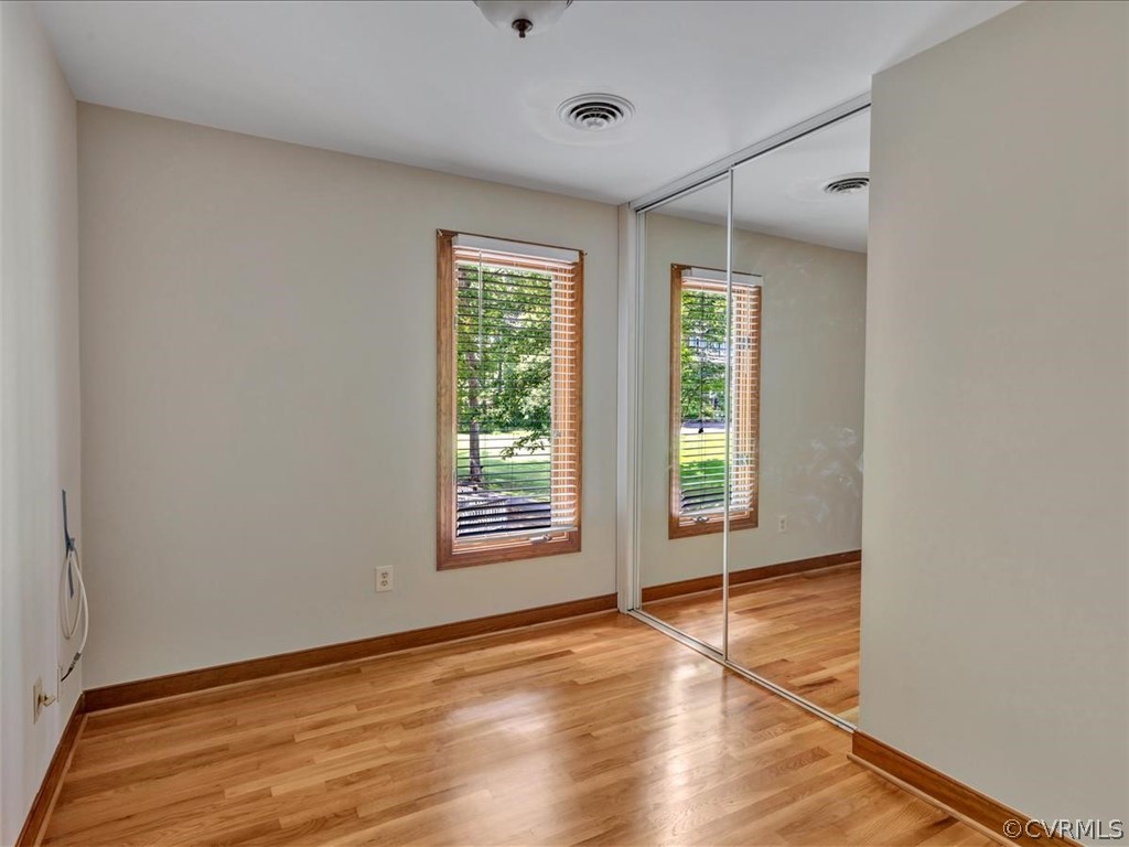 13800 Sterlings Bridge Road Midlothian, VA 23112 - Photo 20 of 31 a view of an empty room with wooden floor and a window