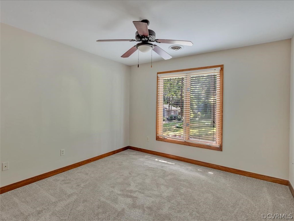 13800 Sterlings Bridge Road Midlothian, VA 23112 - Photo 21 of 31 an empty room with a ceiling fan and window