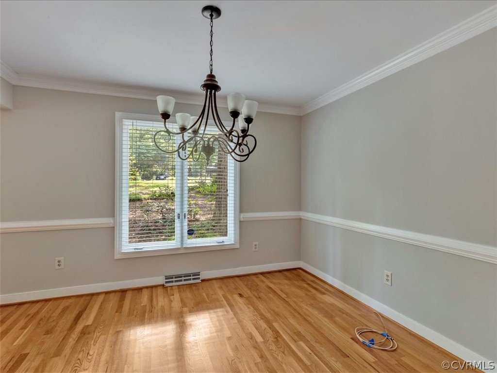 13800 Sterlings Bridge Road Midlothian, VA 23112 - Photo 6 of 31 a view of an empty room with wooden floor and a window
