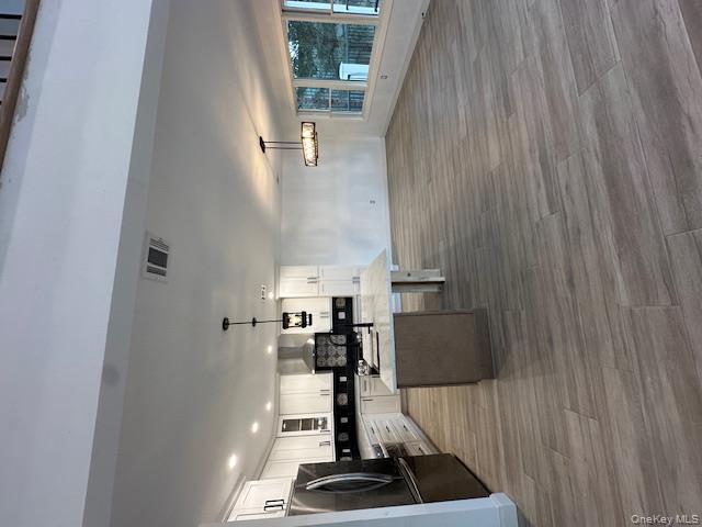 74 Beach Road Stony Point, NY 10980 - Photo 11 of 38 a living room with stainless steel appliances kitchen island granite countertop a large kitchen counter top space and a sink