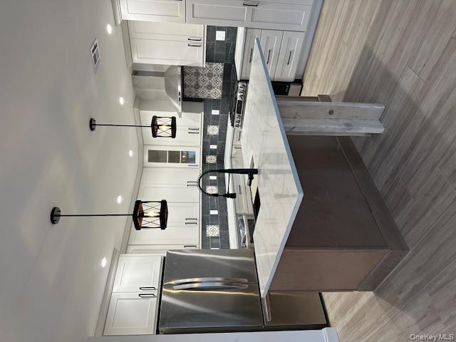 74 Beach Road Stony Point, NY 10980 - Photo 15 of 38 a kitchen with stainless steel appliances granite countertop a sink a stove and a refrigerator