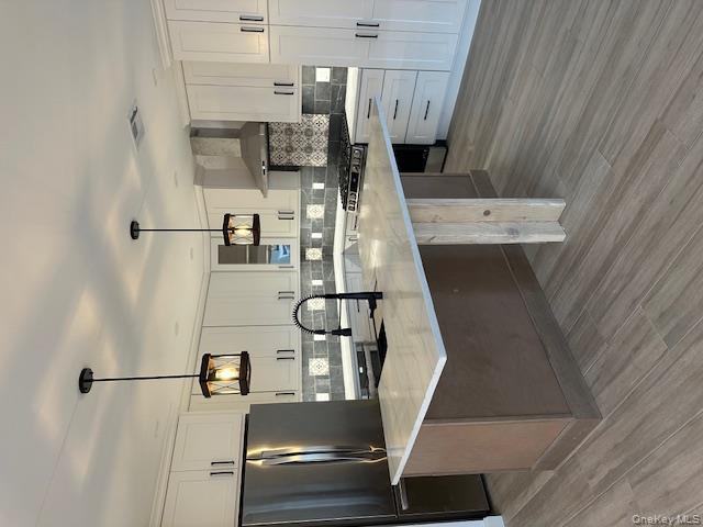 74 Beach Road Stony Point, NY 10980 - Photo 16 of 38 a kitchen with stainless steel appliances granite countertop a sink stove and refrigerator