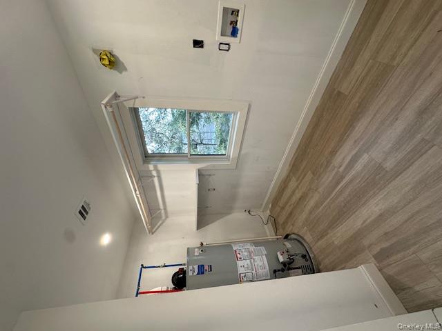 74 Beach Road Stony Point, NY 10980 - Photo 17 of 38 a view of empty room with wooden floor and fan