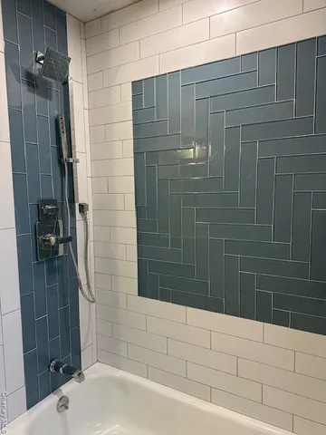a bathroom with a shower and a sink