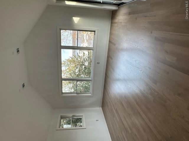 74 Beach Road Stony Point, NY 10980 - Photo 26 of 38 an empty room with wooden floor and windows