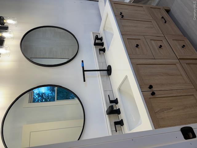 74 Beach Road Stony Point, NY 10980 - Photo 30 of 38 a bathroom with a double vanity sink and a mirror