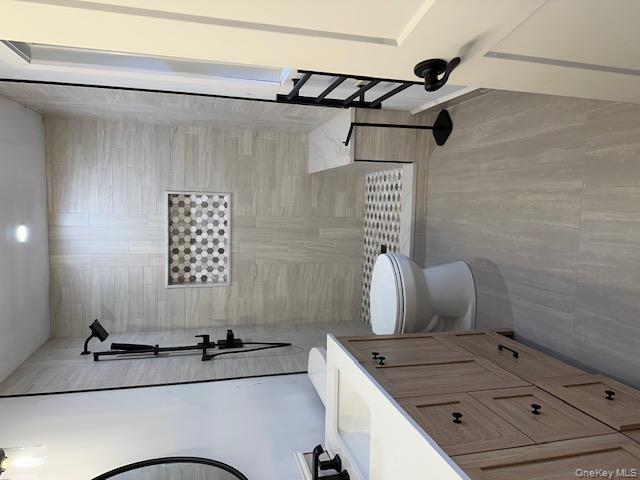 74 Beach Road Stony Point, NY 10980 - Photo 30 of 38 a bathroom with a toilet sink and a mirror