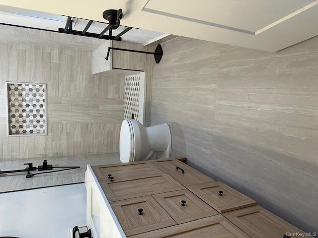 74 Beach Road Stony Point, NY 10980 - Photo 32 of 38 a bathroom with a sink a toilet and shower