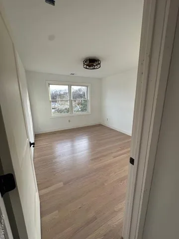 a view of empty room with windows