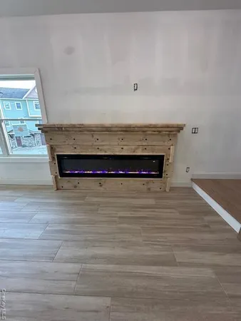 a view of a room with wooden floor and cabinet
