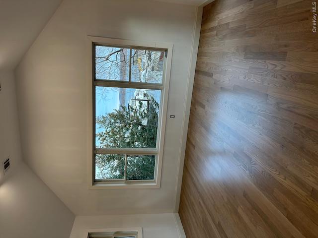 74 Beach Road Stony Point, NY 10980 - Photo 4 of 38 an empty room with wooden floor and windows