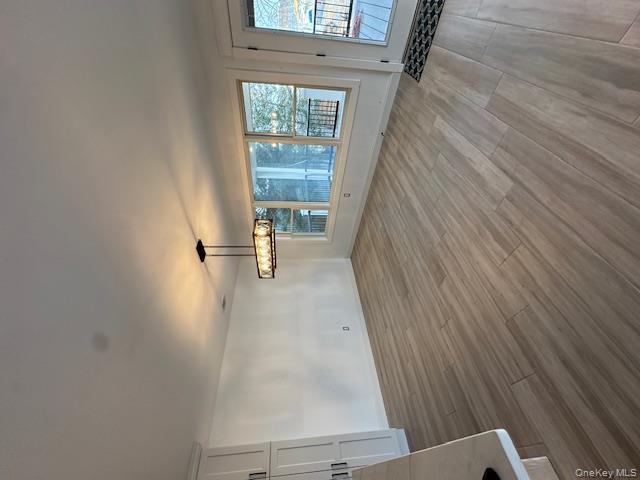 74 Beach Road Stony Point, NY 10980 - Photo 5 of 38 an empty room with wooden floor and windows