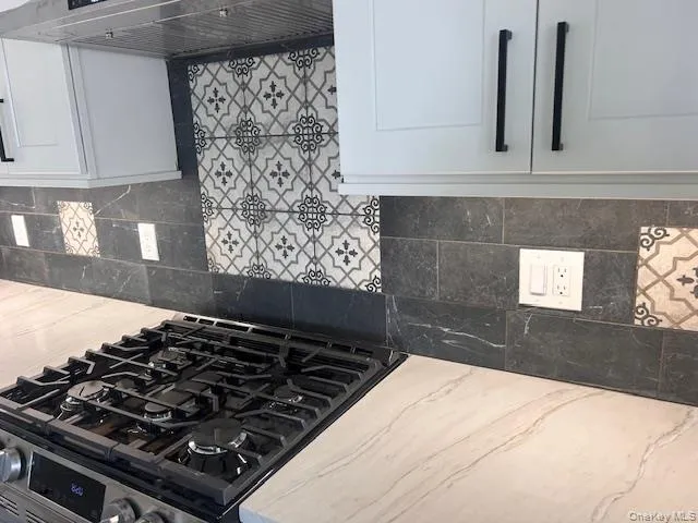 a close view of a stove a microwave and cabinets in the kitchen