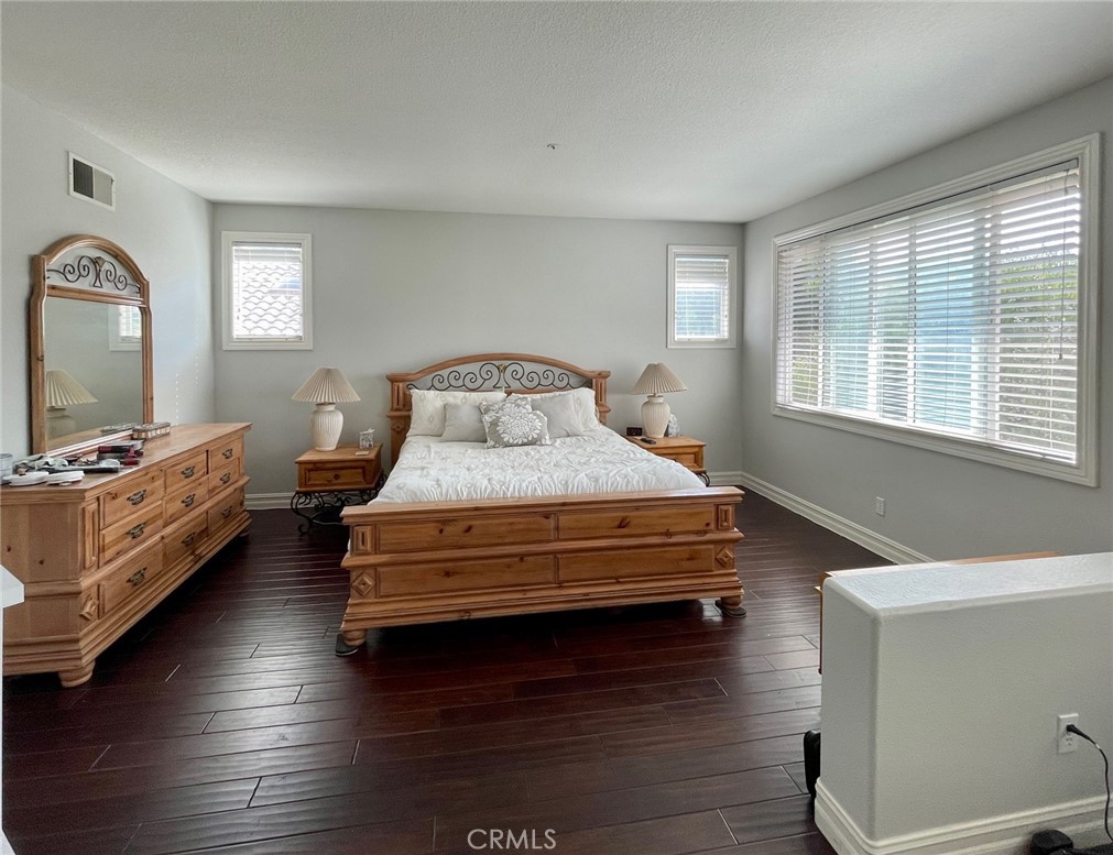 808 Carnaros San Clemente, CA 92672 - Photo 13 of 16 a bedroom with a bed and a large window