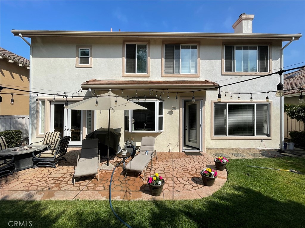 808 Carnaros San Clemente, CA 92672 - Photo 15 of 16 a view of a house with backyard sitting area and garden