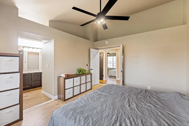 a view of a bedroom with furniture and windows