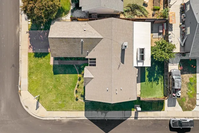 an aerial view of a house with a swimming pool