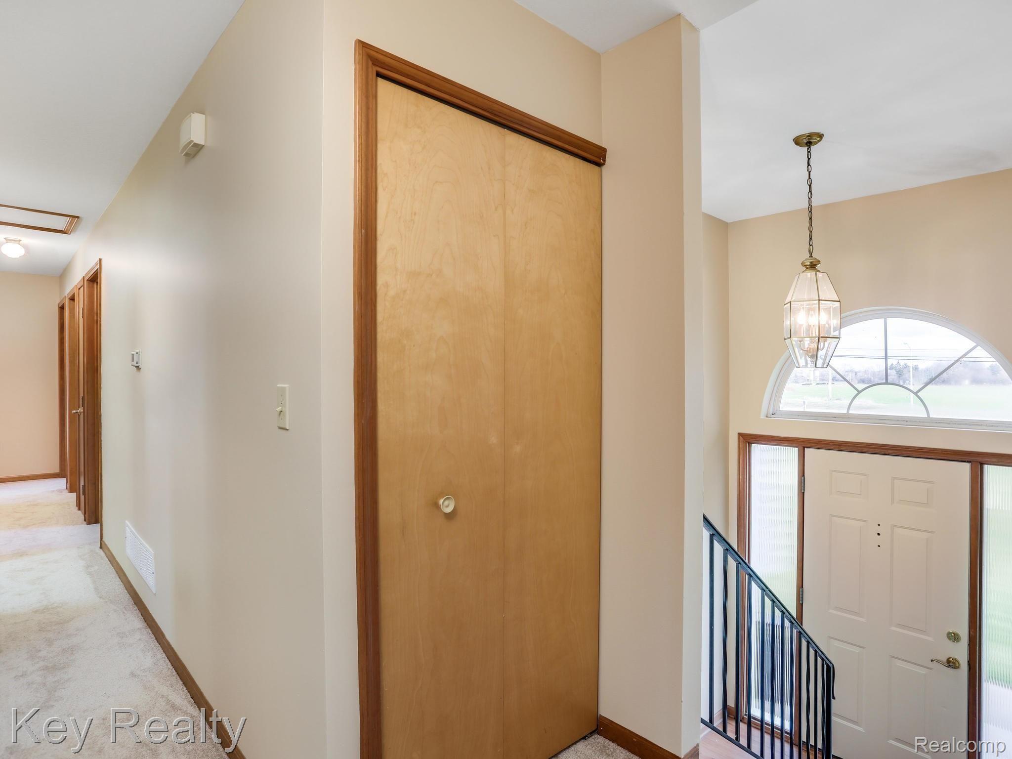 4048 Morrish Road Swartz Creek, MI 48473 - Photo 9 of 40 Upper level foyer and hallway leading to 3 bedrooms, 2 full baths and the laundry room.
