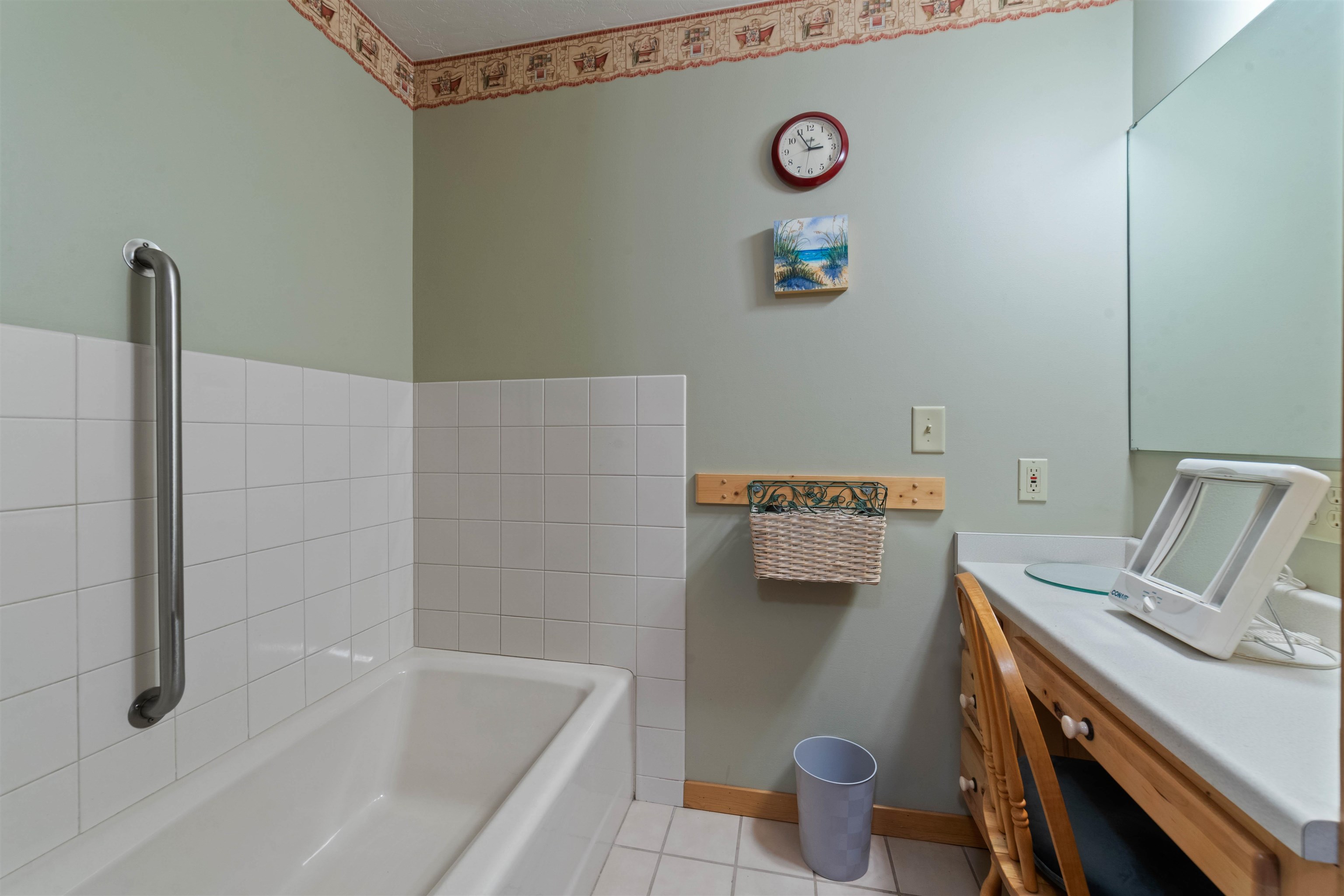 4930 Mini Power Road Duluth, MN 55803 - Photo 13 of 36 Full bath featuring a bath, tile patterned floors, and vanity
