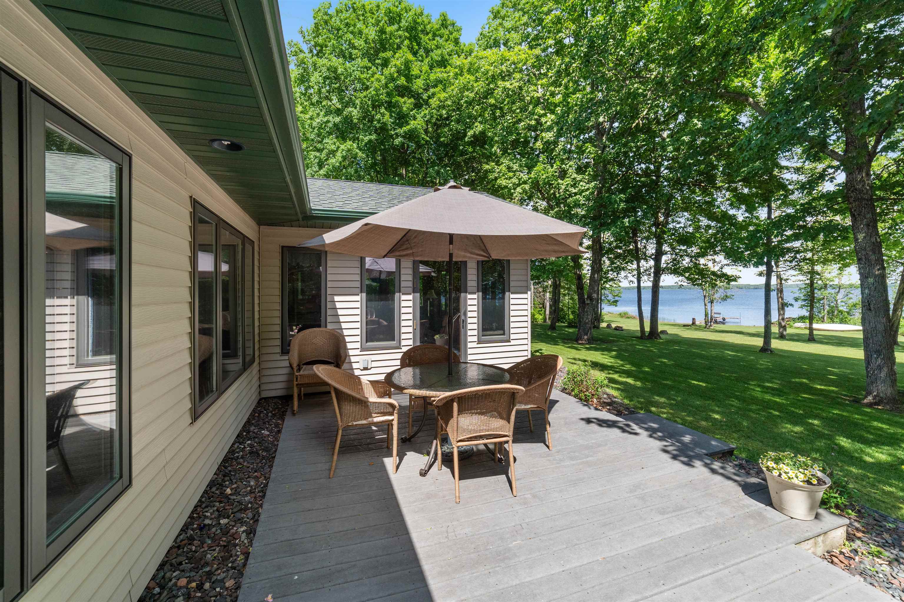 4930 Mini Power Road Duluth, MN 55803 - Photo 31 of 36 Deck with a water view, a yard, and outdoor dining space