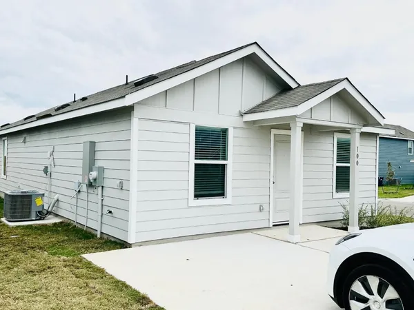 a front view of a house with garage