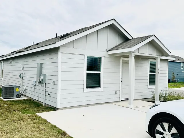 a front view of a house with garage