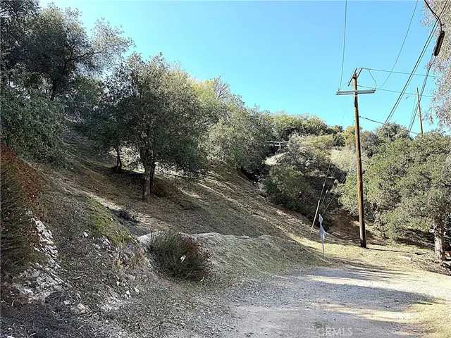 a view of a road with a bench in the background