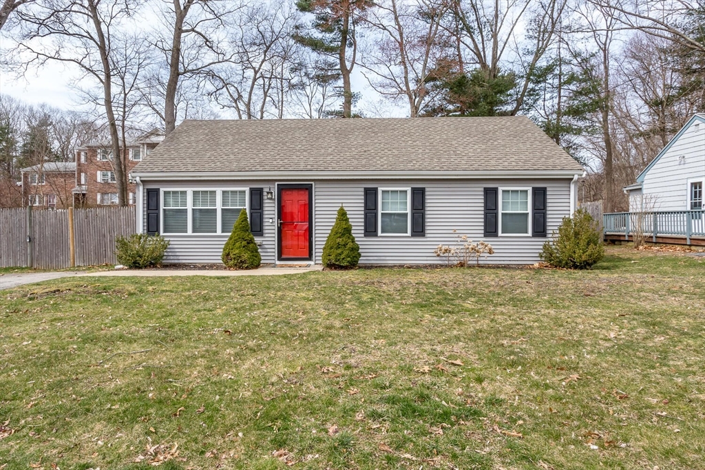 71 Highland Street Canton, MA 02021 - Photo 1 of 12 a front view of house with yard and trees around