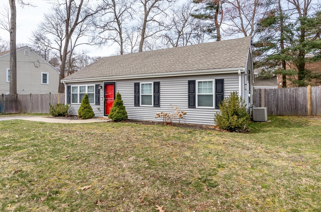 71 Highland Street Canton, MA 02021 - Photo 2 of 12 a front view of house with yard
