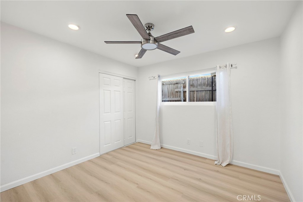 33771 Copper Lantern Street Dana Point, CA 92629 - Photo 9 of 16 a view of a livingroom with a ceiling fan & wooden floor
