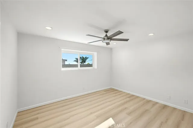 a view of a room with a ceiling fan