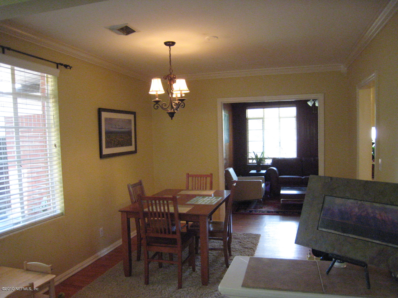1413 Somerville Road Jacksonville, FL 32207 - Photo 3 of 13 a living room with furniture and a chandelier