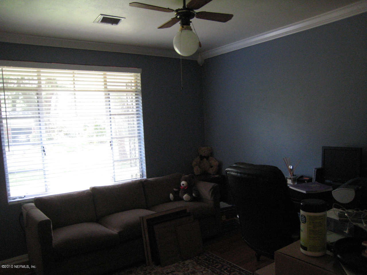 1413 Somerville Road Jacksonville, FL 32207 - Photo 7 of 13 a living room with furniture and a window