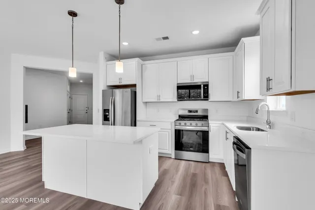 a view of cabinets and wooden floor