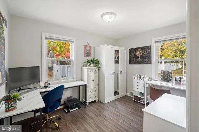 a workspace with furniture and a window