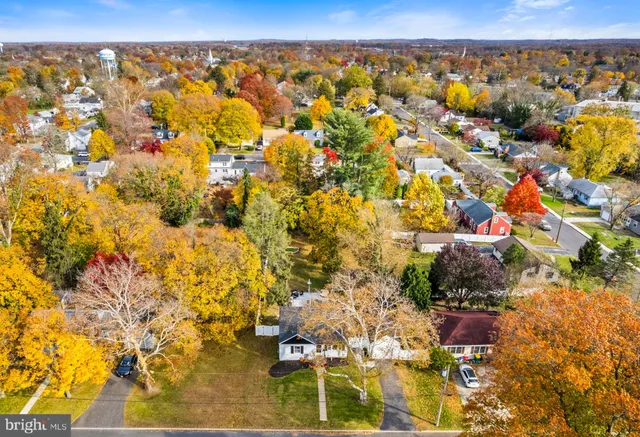 a building view with swimming pool and lawn chairs