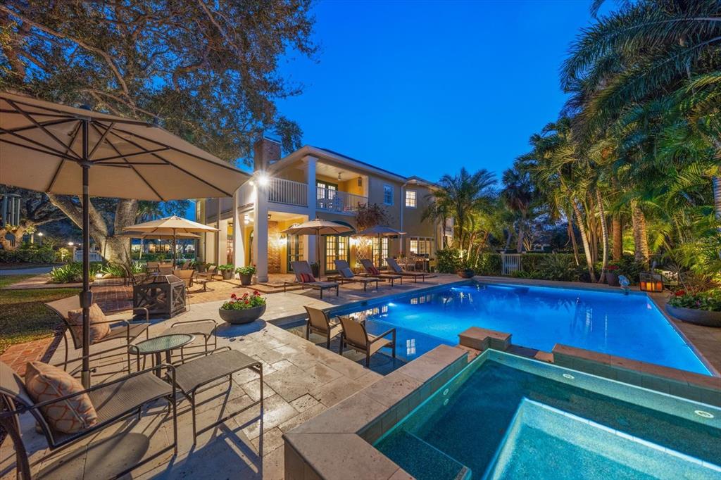 100 Sarasota Road Belleair, FL 33756 - Photo 1 of 75 a view of swimming pool with outdoor seating