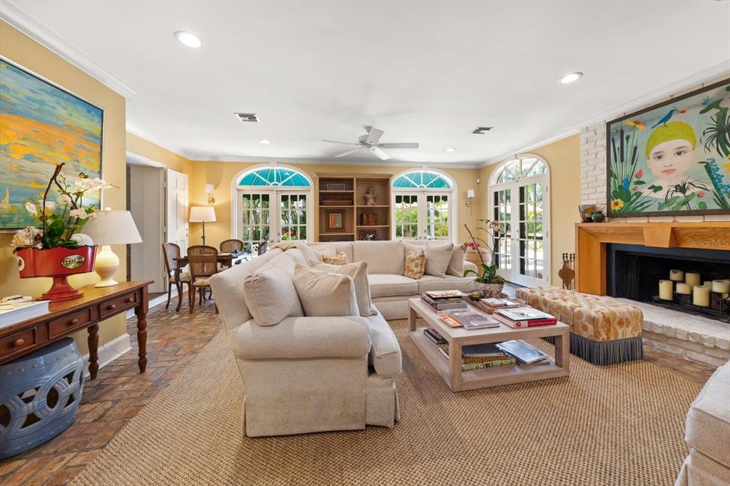 100 Sarasota Road Belleair, FL 33756 - Photo 14 of 75 a living room with furniture fireplace and flat screen tv