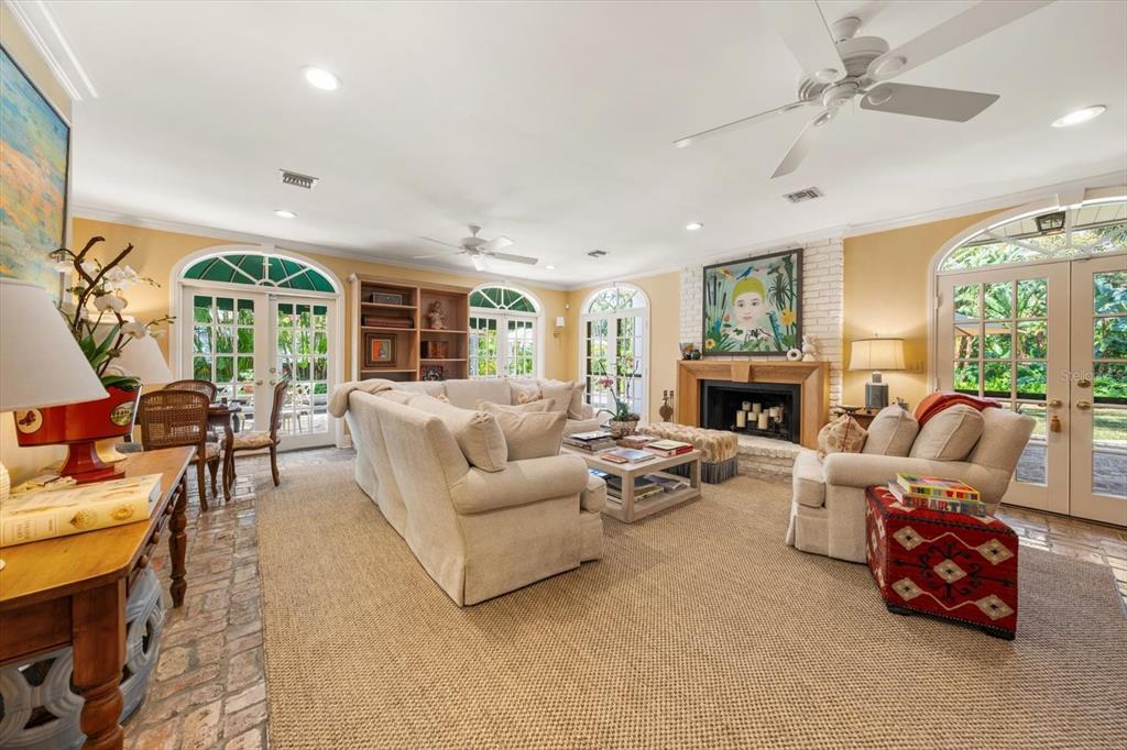 100 Sarasota Road Belleair, FL 33756 - Photo 15 of 75 a living room with furniture fireplace and a large window