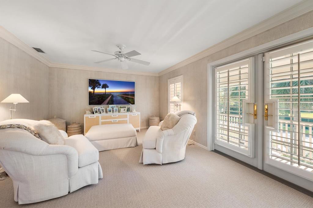 100 Sarasota Road Belleair, FL 33756 - Photo 25 of 75 a living room with furniture and a flat screen tv