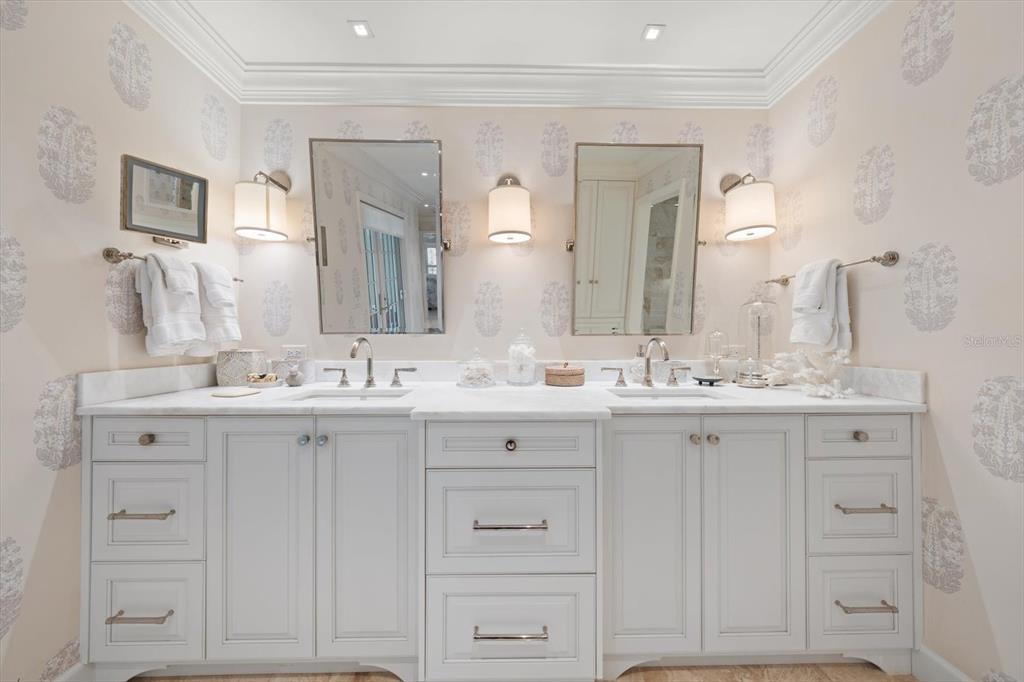 100 Sarasota Road Belleair, FL 33756 - Photo 30 of 75 a bathroom with double vanity sink and a mirror