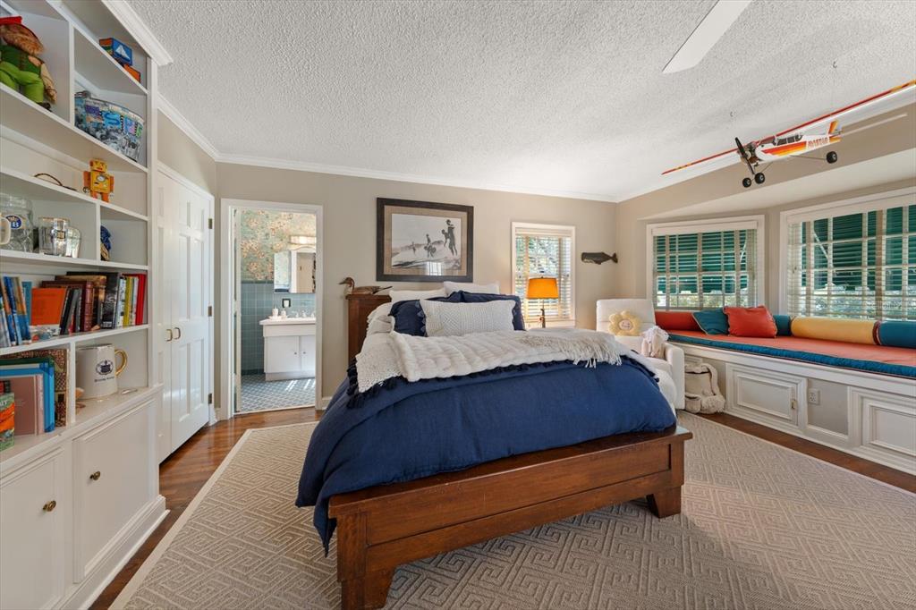 100 Sarasota Road Belleair, FL 33756 - Photo 35 of 75 a spacious bedroom with a bed and a window