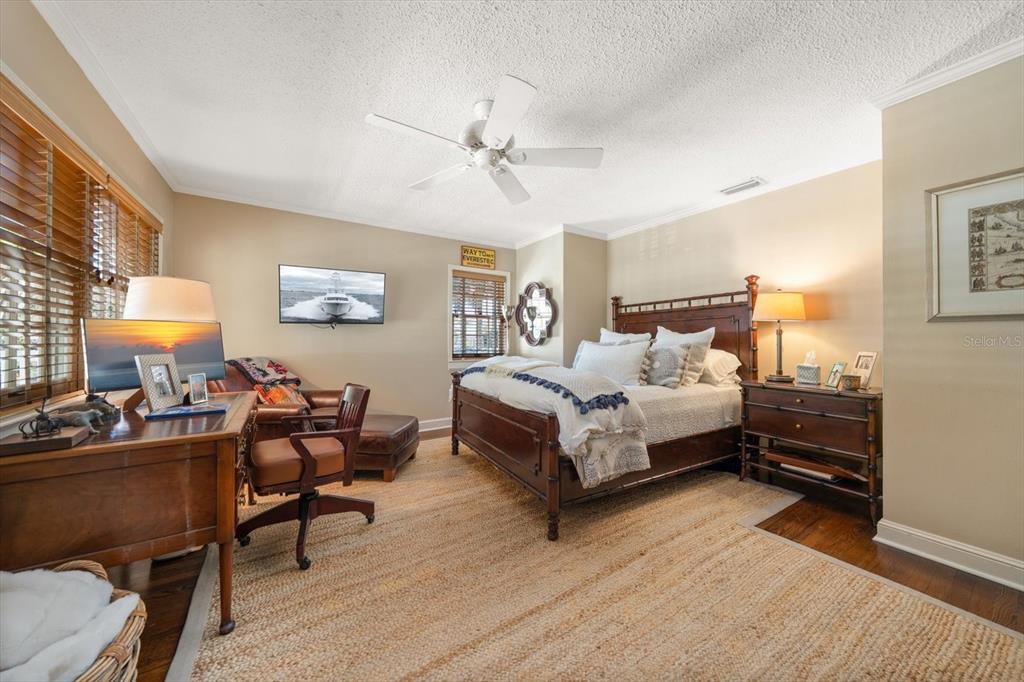 100 Sarasota Road Belleair, FL 33756 - Photo 39 of 75 a bedroom with a bed and a table