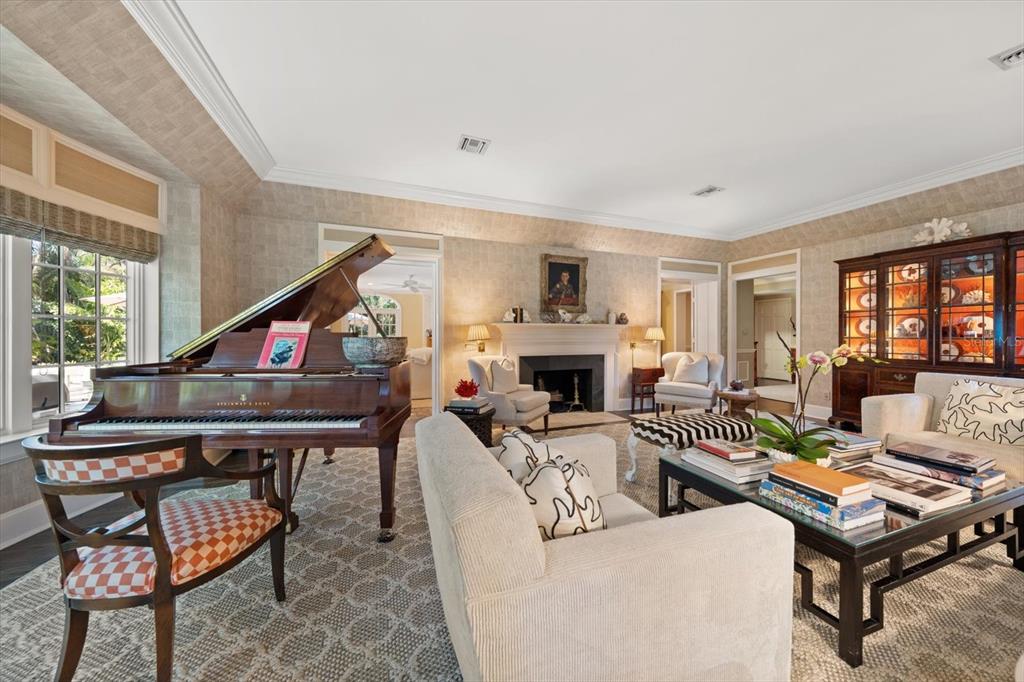 100 Sarasota Road Belleair, FL 33756 - Photo 4 of 75 a living room with furniture a fireplace and a large window