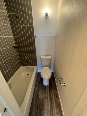 a bathroom with a toilet and a sink