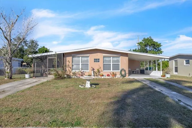 a front view of house with yard patio and green space