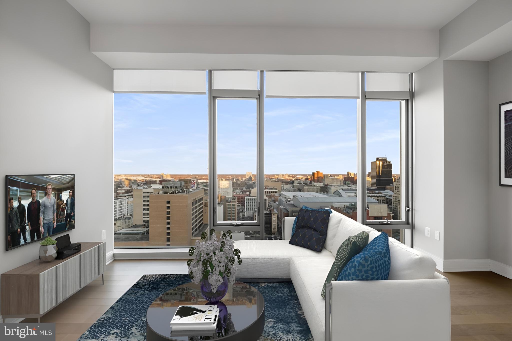 200 North 16th Street, Unit 2218 Philadelphia, PA 19102 - Photo 4 of 20 a living room with furniture and a large window