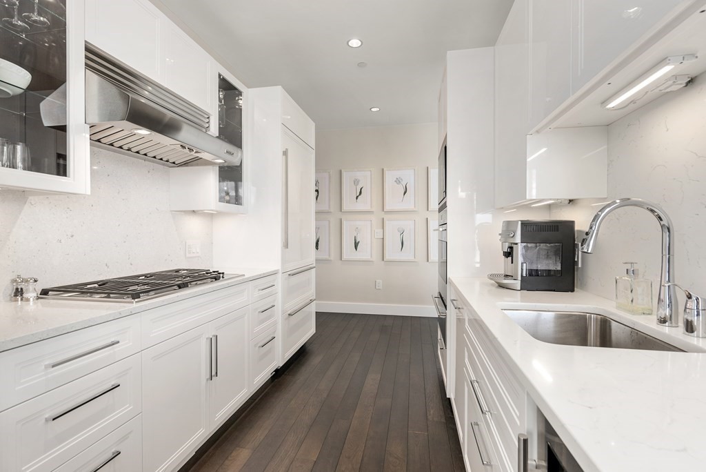 22 Liberty Drive, Unit 6A Boston, MA 02210 - Photo 12 of 42 a kitchen with stainless steel appliances granite countertop a sink stove and refrigerator