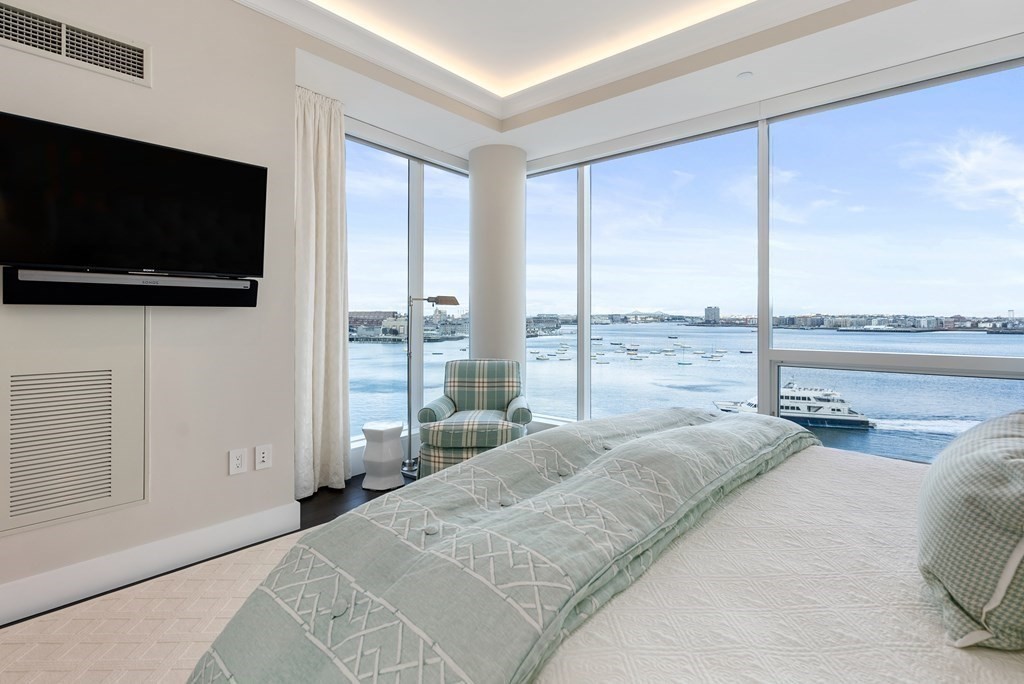 22 Liberty Drive, Unit 6A Boston, MA 02210 - Photo 16 of 42 a bedroom with a bed and a flat screen tv